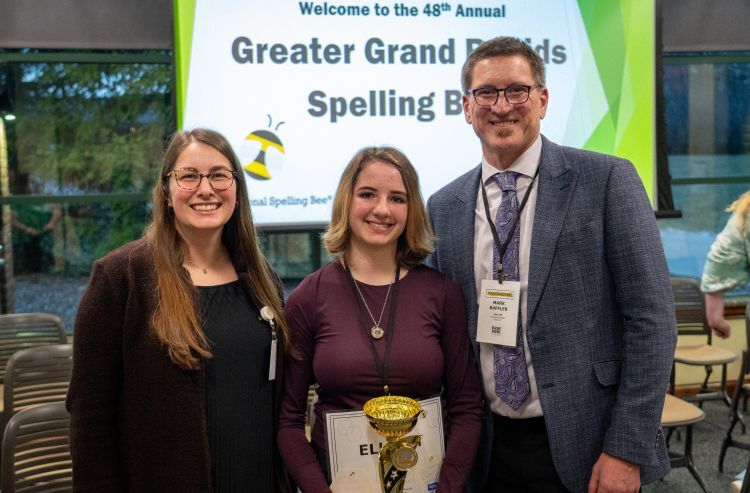 Spelling Bee winner Elliott Covelle with organizer and moderator of the Spelling Bee